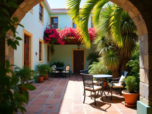 Lush tropical courtyard of a historic guesthouse in Frederiksted