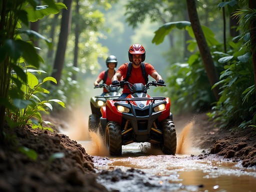 Couple riding ATVs through lush jungle trail in Koh Samui's interior