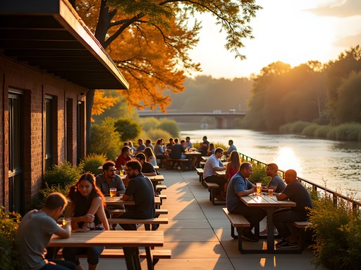 Outdoor brewery patio in Columbus with autumn foliage and river views