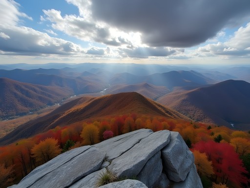 Panoramic view from Looking Glass Rock summit showing Blue Ridge Mountain ranges in autumn
