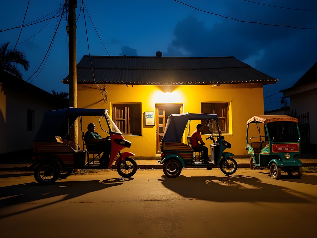Colorful pousse-pousse rickshaws lined up at night in Antsirabe with neon lights from nearby bars